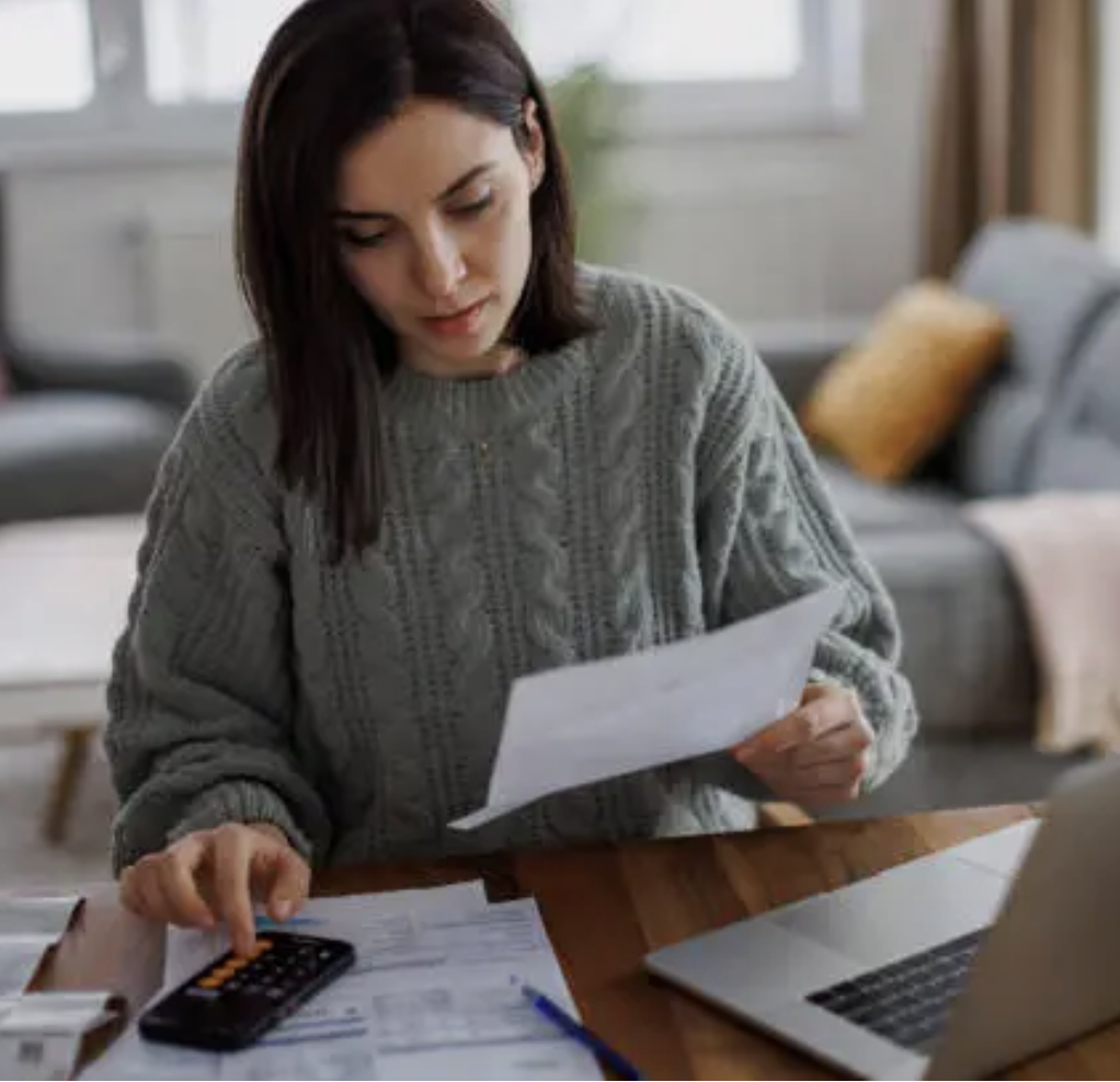 Woman reviewing personal documents at home